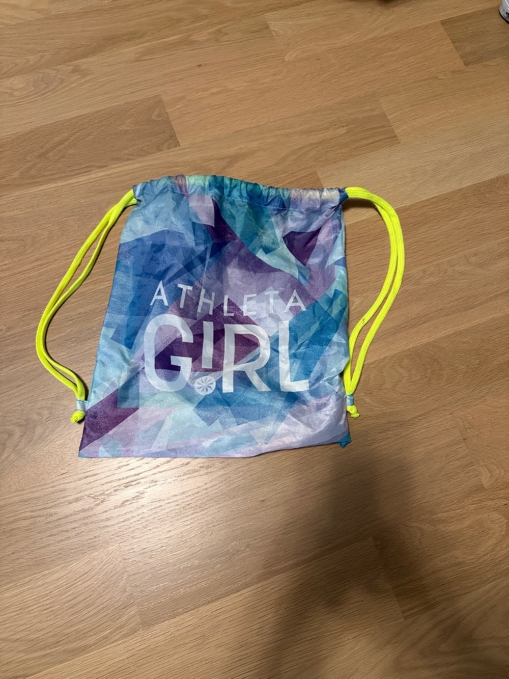 Athleta Multicolor Geometric Drawstring Backpack with Neon Yellow Cords